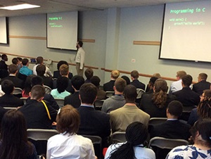 NYLF Engineering students listen to an interactive presentation from an engineering professional.