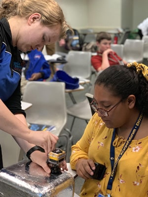 High school student building a can satellite at Rice University's Aerospace & Aviation Academy