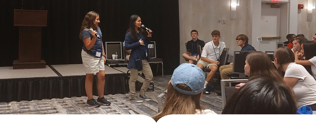 students speak in front of peers