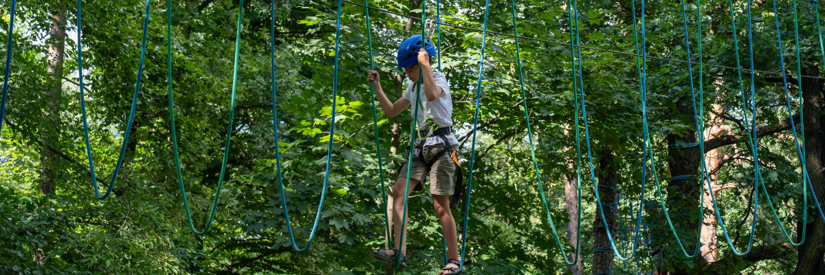 Child completing a ropes course