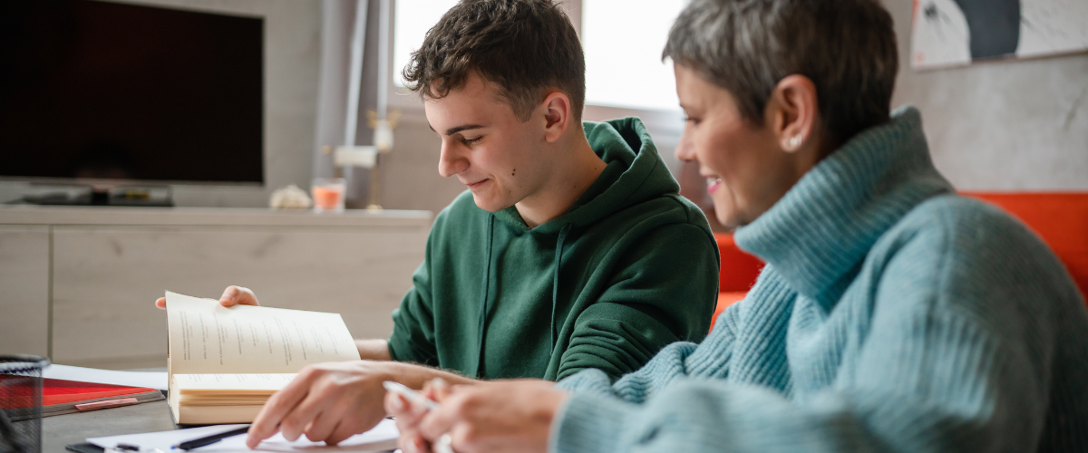 Mom helping son study