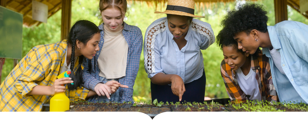 teacher and students watering plants