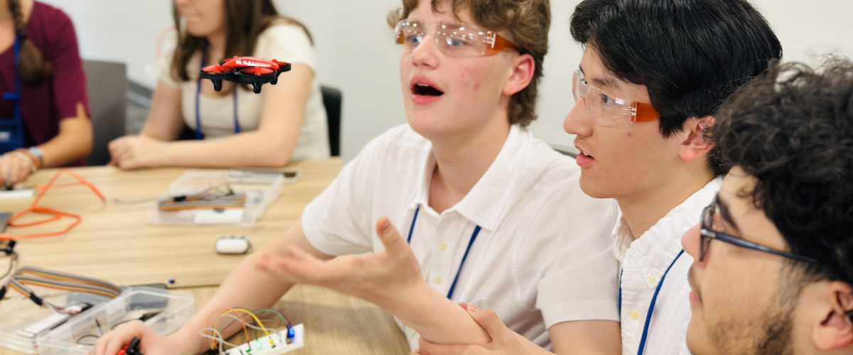 Students working on a small drone